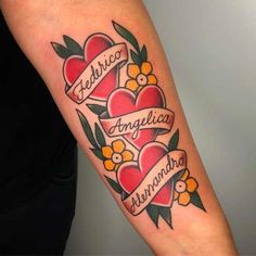 a woman with a tattoo on her arm that has hearts and flowers in the middle