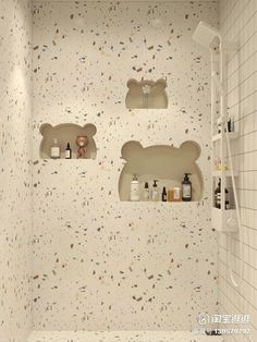 there are three shelves in the shower with bottles on them