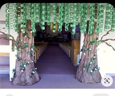 a church decorated with green ribbons and trees