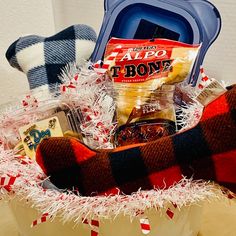 a basket filled with candy and snacks on top of a table