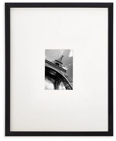 black and white photograph of the eiffel tower in paris, france with sky background