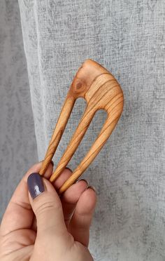 Overall length: 4,7 inches (12 cm) Functional prong length: 3,5 inches (8,9 cm) Top wide: 1,8 inches (4,5 cm) Hand Carved Wooden Hair Fork From the Cherry Wood. This hair fork is very smooth and easily slide into hair while holding it perfectly in shape. The wood has been treated with natural oil. To finalize the hair fork, it is polished to a high shine. Leaving you with not only a useful and functional tool but also a beautiful decoration for your hair. Great for all hair types: straight, wavy Wooden Hair Pins Handmade, Wooden Hair Pins, Hair Accessories Bun, Stick Wood, Eco Beauty, Eco Friendly Accessories, Hair Fork, Hang Loose, Hair Stick