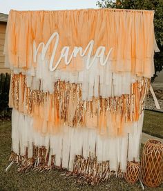 an orange and white backdrop with the word mama on it