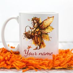 a coffee mug with an image of a fairy on it