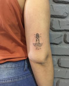 Unique & Cute Travel Tattoo Ideas For Women Tiny Lighthouse Tattoo, Small Lighthouse Tattoo Simple, Simple Lighthouse Tattoo, Lighthouse Tattoo For Women, Minimalist Lighthouse Tattoo, Travel Tattoo Ideas For Women, Lighthouse Tattoo Design, Travel Inspired Tattoos, Watercolor Bike