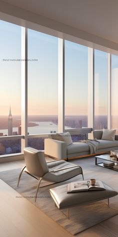 a living room filled with furniture and large windows overlooking the cityscape in the distance