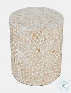 a white and gold mosaic table on a white background