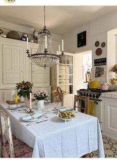 a dining room table is set with plates and silverware