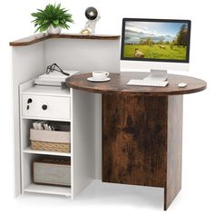 a computer desk with a monitor and keyboard on top of it next to a shelf