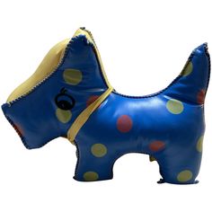 an inflatable blue dog with polka dots on it's head and tail