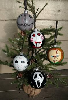 a christmas tree decorated with halloween ornaments