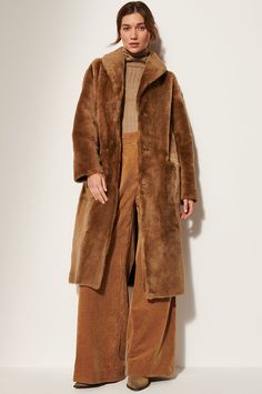 Cloak yourself in impeccable softness and warmth this winter in the Sofia sheepskin coat, crafted from delicate Spanish Lacón shearling. Offering two beautiful styles in one sweeping design, this button-front coat boasts a luxurious feel on both the smooth full-grain Napa side and the plush fur-out side. Raw-edge cuffs and hem lend rustic richness to this stunning and versatile coat, while two patch pockets leave room for gloves. Sheepskin Coat, Shearling Coat, Cloak, Sofia, Full Length, Winter Fashion, How To Wear