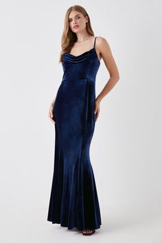 a woman in a blue velvet dress