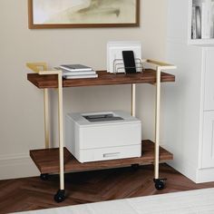 a computer desk with a printer on it