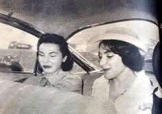 two women sitting in a car talking to each other