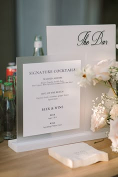 a table with flowers and menus on it