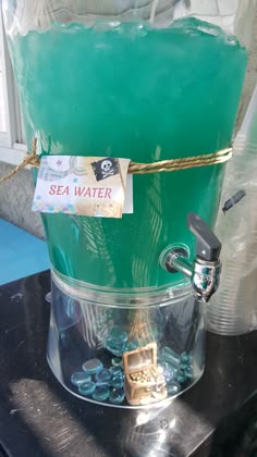 there is a blue liquid in the water with a sign on it that says sea water