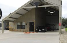 a car is parked in front of a garage