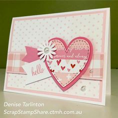 a card with a heart and ribbon on it