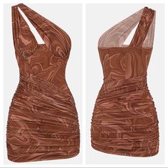 a dress made out of brown material with cutouts on the shoulders and back sides