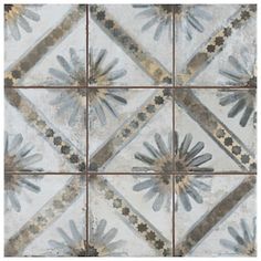 an artistic tile design with blue and gray flowers on the bottom, in square tiles