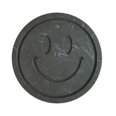 a smiley face made out of black marble