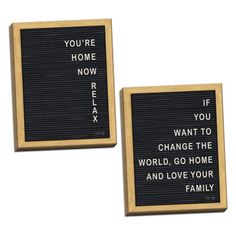 two black and gold framed signs that say you're home now, if you want to change the world, go home and love your family