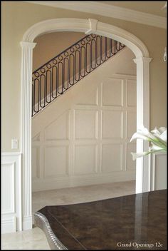 an entry way with a table and stairs