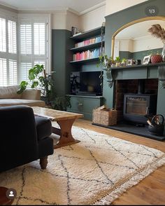 a living room filled with furniture and a fire place