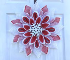 This Winter Snowflake Wreath in red and white with flocked wooded snowflake center for your front door holiday decor on thru the winter months would also be a great gift wreath. The wreath may be displayed on your front door, porch or indoors. I have sprayed with a UV protectant spray to reduce raveling and fading however I recommend displaying under a covered stoop or porch to lengthen the life of your wreath. This is made on a recycled plastic wreath board. Follow this link for more Christmas items: https://www.etsy.com/shop/MemawsCottage?ref=seller-platform-mcnav&section_id=30402647 PLEASE NOTE SHIPPING TIMES CAREFULLY AS THEY CHANGE FROM TIME TO TIME DUE TO PERSONAL CIRCUMSTANCES. Wreath With Garland, Red White Christmas Wreath, Christmas Flower Wreaths, Christmas Deco Mesh Wreaths, Couronne Diy, Gift Wreath, Snowflake Wreath, White Christmas Wreath, Front Door Christmas Decorations