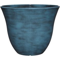 a large blue planter sitting on top of a white surface with no one in it