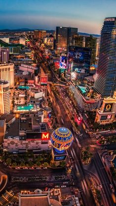 an aerial view of the las vegas strip at night with neon lights and hotels in the background