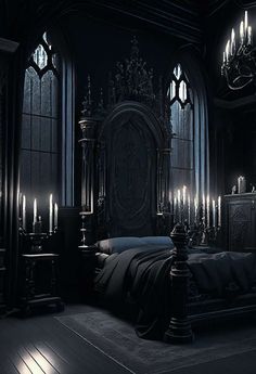 a gothic bedroom with candles lit up in the dark