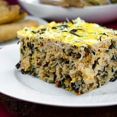 a close up of a piece of food on a plate with other plates in the background