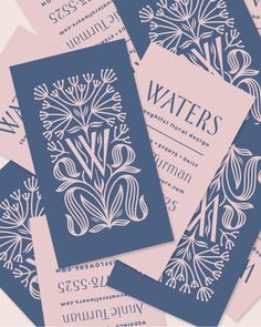 blue and pink wedding stationery with water's printed on the front, back and sides