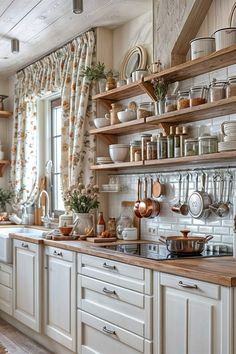 a kitchen filled with lots of white cabinets and wooden shelves covered in pots and pans