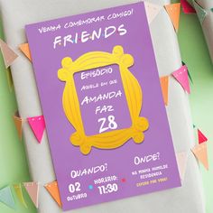 an advertisement for friends magazine on a table with colorful paper garlands and bunting