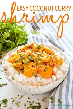 an easy coconut curry shrimp recipe on top of white rice in a bowl with cilantro and parsley