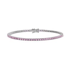 Enhance your jewelry collection with the captivating beauty of our Pink Sapphire Tennis Bracelet. Adorned with vivid pink gemstones, this exquisite piece radiates elegance and charm. Available in 14K Yellow Gold and White Gold Carat weights are reflective of a 7in bracelet. Shorter lengths will have lower carat weights that those listed. Gemstones are natural, therefore colors may vary Luxury Pink Jewelry With Prong Setting, Classic Pink Tennis Bracelet With Jubilee Style, Classic Pink Tennis Bracelet With Jubilee Design, Formal Pink Diamond Bracelet With 17 Jewels, Fine Jewelry Bracelets With Sparkling Stones, Formal Pink Gemstone Tennis Bracelet, Pink Jubilee Tennis Bracelet In Classic Style, Classic Pink Tennis Bracelet, Classic Pink Bracelets