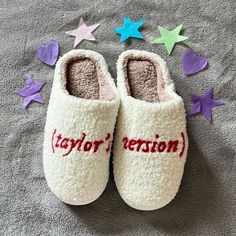 a pair of slippers with the word taylor written on them and stars scattered around