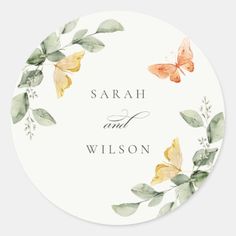 a round sticker with watercolor butterflies on it