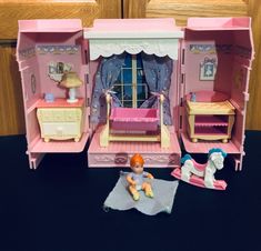 a doll house with furniture and accessories including a horse, bed, dresser and chair