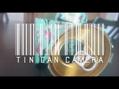 a barcode photo with the word tin can camera on it and some wrapped presents