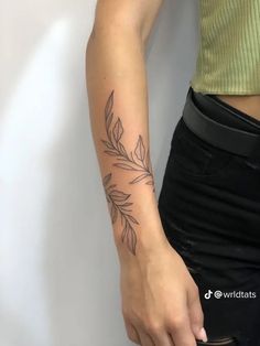 a woman with a tattoo on her arm