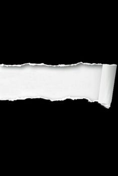 a torn piece of white paper on a black background