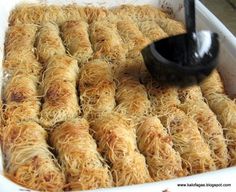 a pan filled with some kind of food that looks like rice krispy kreme rolls