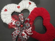 two valentine's day wreaths with hearts on them