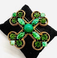 Gorgeous Large Vintage signed CAPRI Peking Glass & Rhinestone Maltese Cross Brooch. Antiqued gold plated metal set with Peking Glass stones as well as green rhinestones. In excellent vintage condition with minimal age appropriate wear. No chips or cracks. Measures 2 7/8 inches tall and wide. Roll over clasp secure. Elegant Green Jeweled Brooches, Vintage Green Brooch Jewelry, Antique Green Jeweled Jewelry, Victorian Green Collectible Brooches, Ornate Green Brooches For Wedding, Vintage Green Jeweled Jewelry, Green Jeweled Brooch Gift, Green Jeweled Brooches For Gifts, Green Jeweled Brooches As Gift