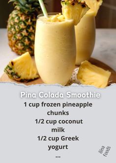 a pineapple smoothie is served in two glasses