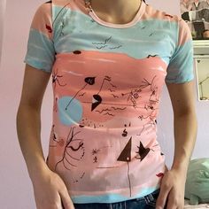 Unique Adorable Sheer Medium Sized Top With Graphic Design On It. From The Brand Lady Oh. Small Hole In The Armpit But Barely Noticeable. Never Worn By Me :( Adorable Pastel Colors. Can Fit A Small As Well. Retro Pink Printed T-shirt, Fitted Pink Printed T-shirt, Pink Retro Printed T-shirt, Fitted Printed Pink Tops, Fitted Pink Printed Tops, Fitted Pink T-shirt For Summer, Pink Retro Stretch Top, Pink Stretch Retro Top, Retro Stretch Pink Top